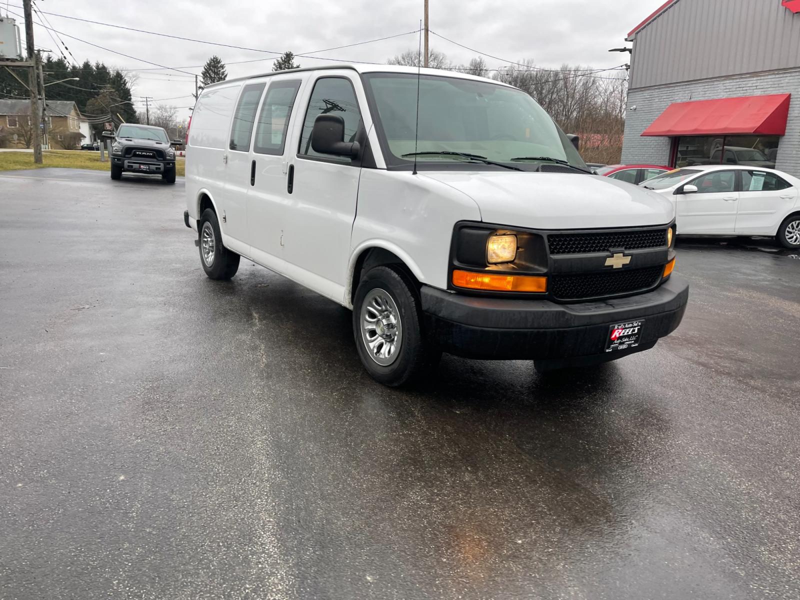 2014 White /Neutral Chevrolet Express 1500 AWD Cargo (1GCSHAF4XE1) with an 5.3L V8 OHV 16V FFV engine, 4-Speed Automatic transmission, located at 547 E. Main St., Orwell, OH, 44076, (440) 437-5893, 41.535435, -80.847855 - This 2014 Chevrolet Express 1500 Cargo Van with a 5.3L Vortec V8 engine and all-wheel drive is a versatile and robust vehicle designed to meet various transportation and towing needs. It comes equipped with convenient features such as power windows, power locks, and a backup camera for safer reversi - Photo #2